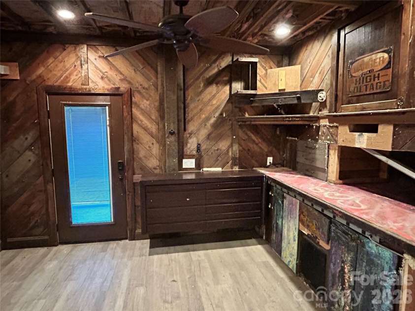 330 Potts Drive, Waynesville, NC 28785.  MLS# CAR4356254, YatesRealty ID 17729. Workshop area in basement