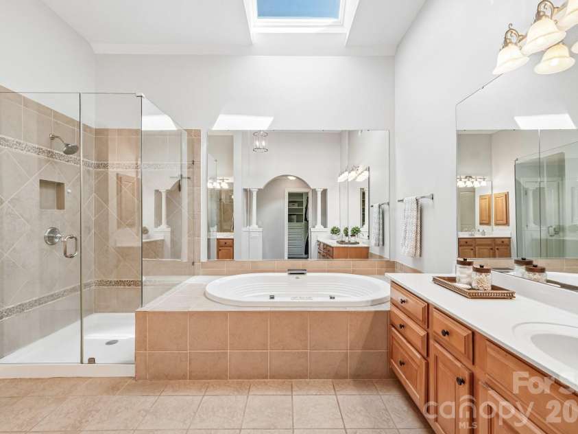 29023 Villa View Court, Fort Mill, SC 29707.  MLS# CAR4372357, YatesRealty ID 17732. Primary bath with skylight & dual vanities