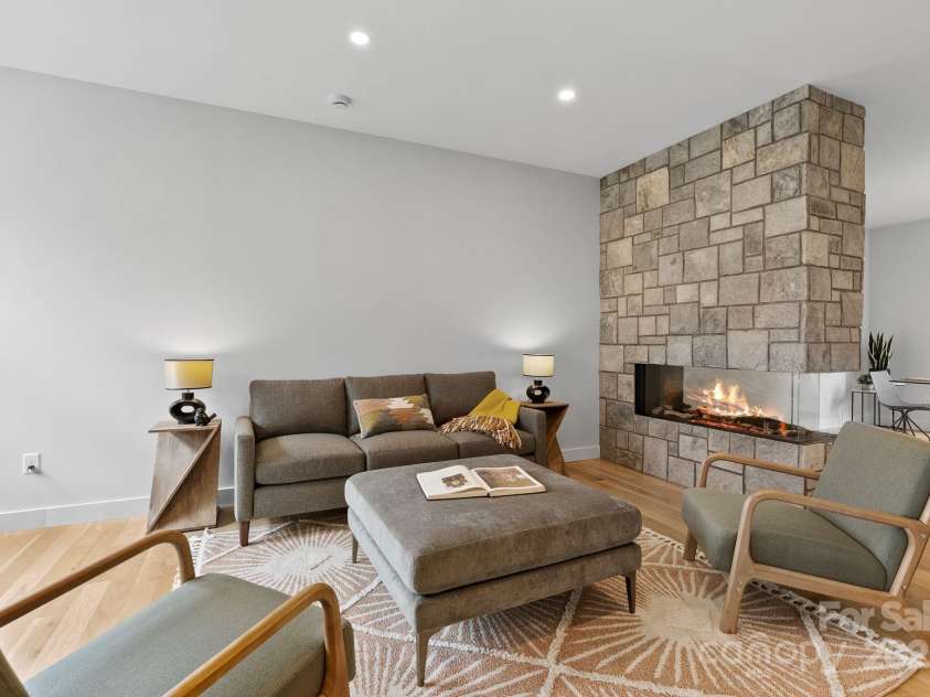 520 Tenth Street, Black Mountain, NC 28711.  MLS# CAR4247176, YatesRealty ID 17733. Two-sided Fireplace with Stone Surround