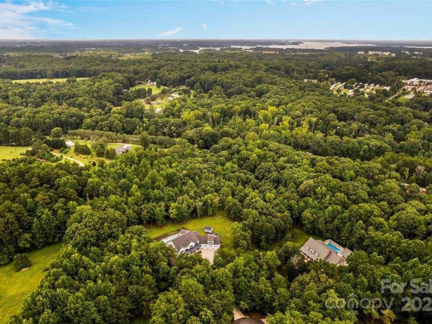 127 Tradition Lane, Mooresville, NC 28115.  MLS# CAR4165702, YatesRealty ID 17737. Aerial View of Home and Acreage; Lake Norman nearby!