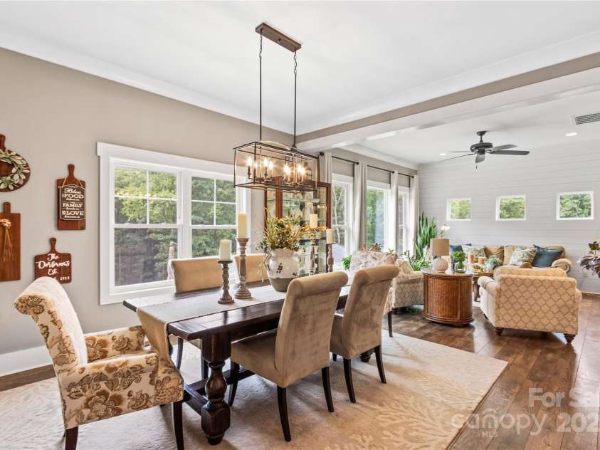 127 Tradition Lane, Mooresville, NC 28115.  MLS# CAR4165702, YatesRealty ID 17737. Dining overlooks Pool and Acreage