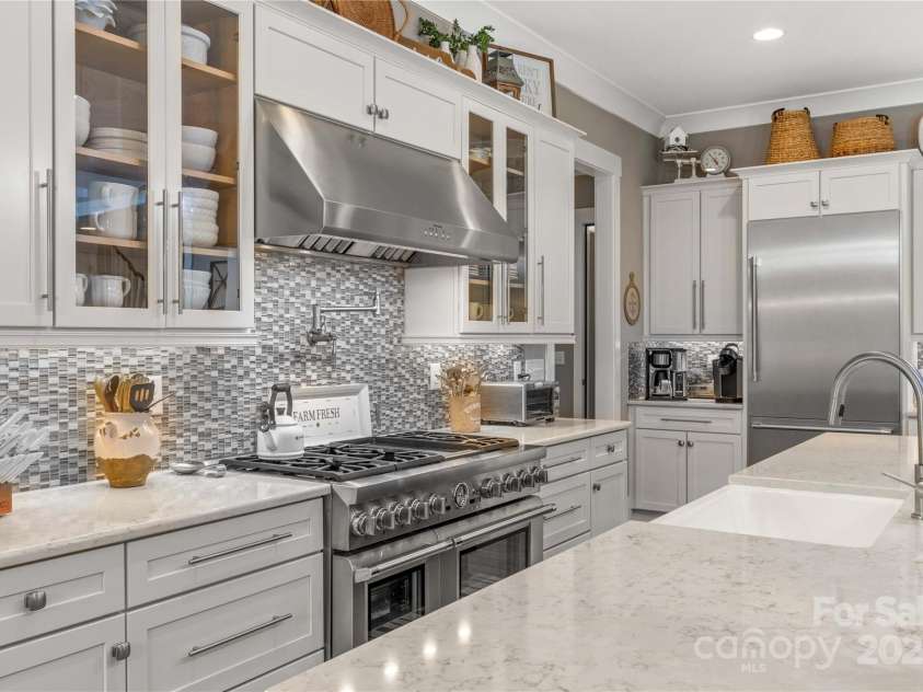 127 Tradition Lane, Mooresville, NC 28115.  MLS# CAR4165702, YatesRealty ID 17737. Gas Range, Pot Filler, Tile Backsplash
