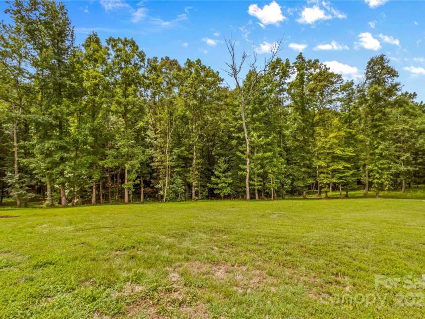 127 Tradition Lane, Mooresville, NC 28115.  MLS# CAR4165702, YatesRealty ID 17737. View of Back Yard, Acreage