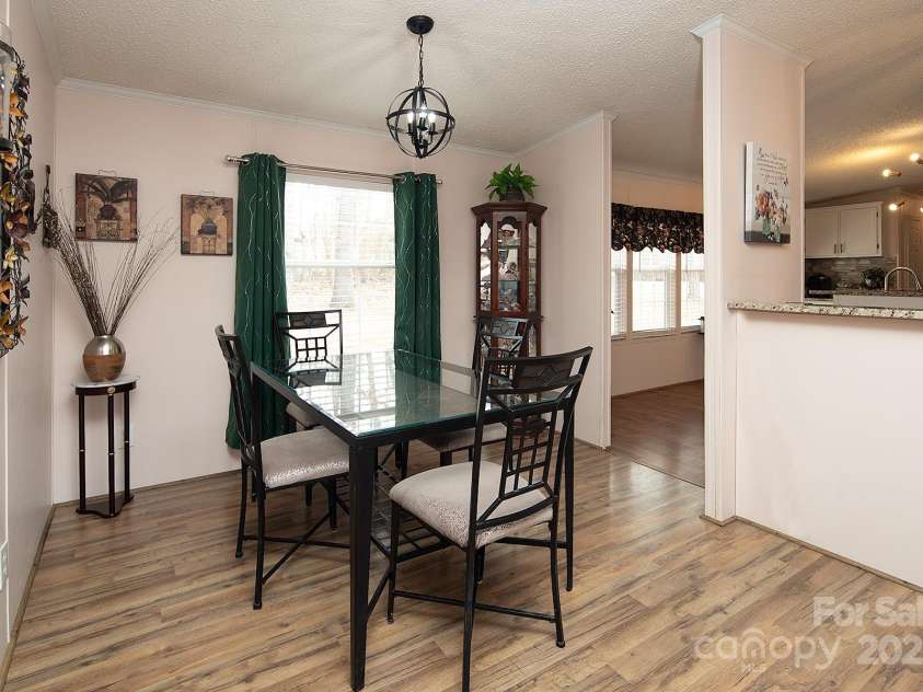 115 Tradewinds Court, Mooresville, NC 28115.  MLS# CAR4215397, YatesRealty ID 1774. Dining area is located just off the kitchen and opens to the family room.