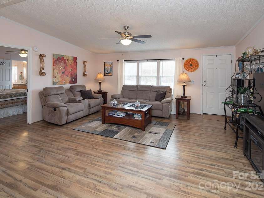 115 Tradewinds Court, Mooresville, NC 28115.  MLS# CAR4215397, YatesRealty ID 1774. Family room features beautiful LVP flooring.