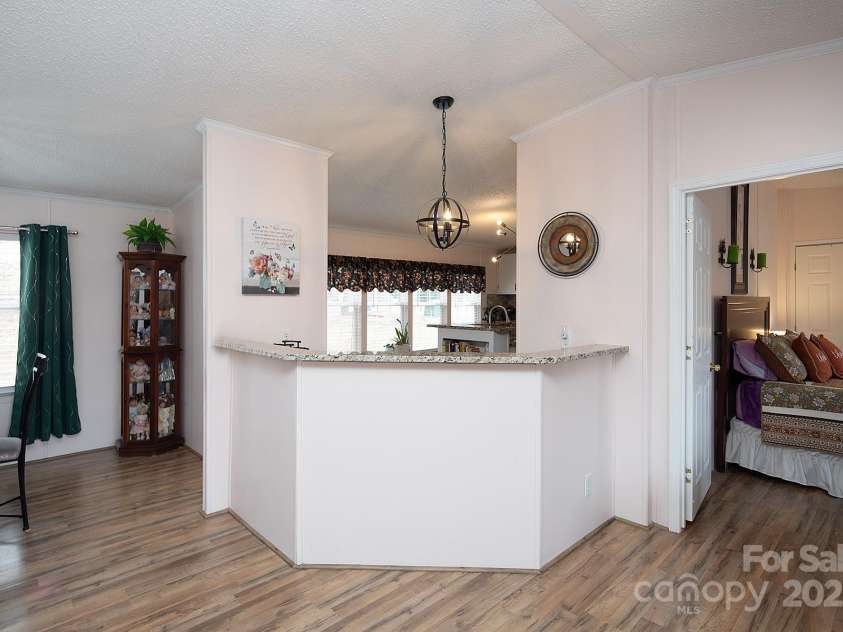 115 Tradewinds Court, Mooresville, NC 28115.  MLS# CAR4215397, YatesRealty ID 1774. Kitchen opens to the dining and family room.