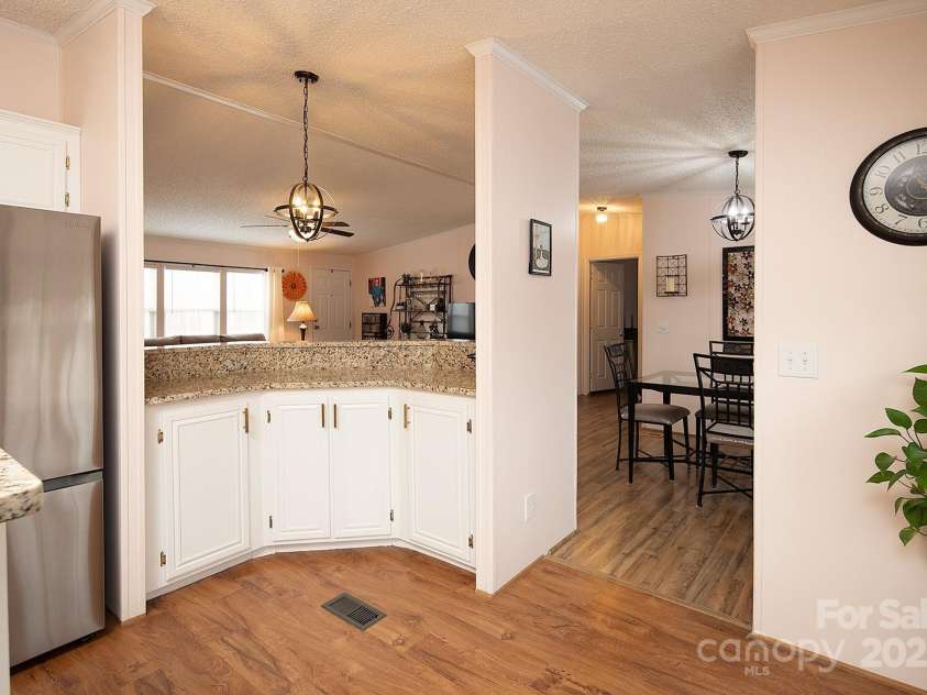 115 Tradewinds Court, Mooresville, NC 28115.  MLS# CAR4215397, YatesRealty ID 1774. Kitchen overlooks the family and dining area.