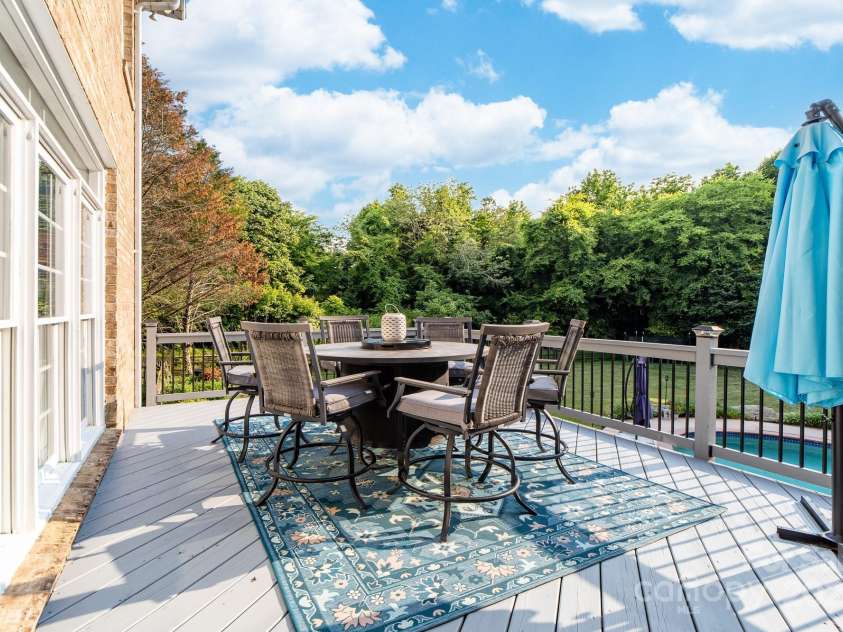 1115 Maremont Court, Matthews, NC 28104.  MLS# CAR4265008, YatesRealty ID 17750. 18 X 12 upper level deck overlooking the swimming pool and private backyard.