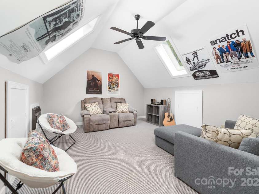 1115 Maremont Court, Matthews, NC 28104.  MLS# CAR4265008, YatesRealty ID 17750. Bonus room with vaulted ceiling and skylights. Side doors for additional storage in the attic.  There is also a large walk in attic for more storage.