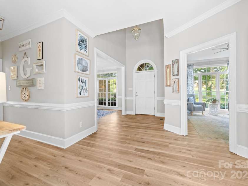1115 Maremont Court, Matthews, NC 28104.  MLS# CAR4265008, YatesRealty ID 17750. Enter into this bright and spacious foyer with light neutral paint and newly installed LVP flooring.  Hardwood floors are beneath the LVP