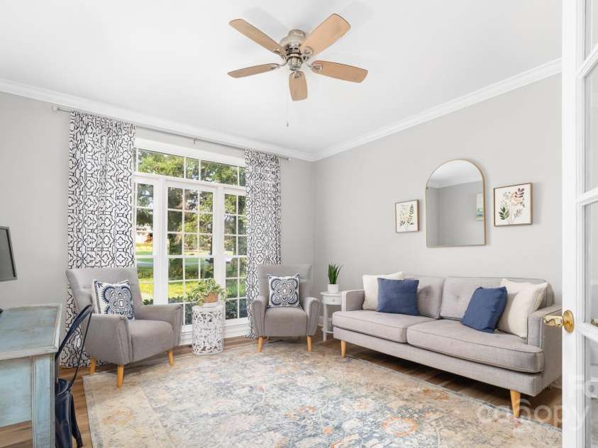 1115 Maremont Court, Matthews, NC 28104.  MLS# CAR4265008, YatesRealty ID 17750. Office with glass french doors on the main level.  Newly installed LVP flooring and ceiling fan.