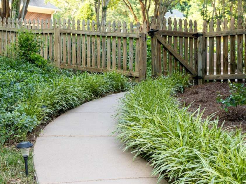 1115 Maremont Court, Matthews, NC 28104.  MLS# CAR4265008, YatesRealty ID 17750. Professionally landscaped walkway leads from the driveway to the fenced yard and pool area