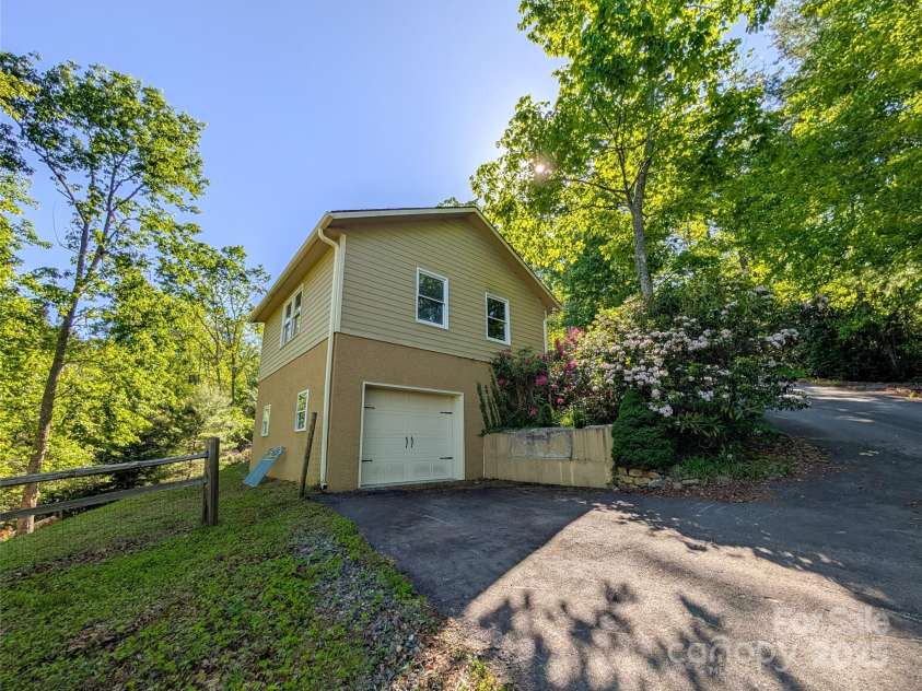 355 Rosewood Lane, Burnsville, NC 28714.  MLS# CAR4326302, YatesRealty ID 17755. Lower Level One Car Garage/Workshop/Studio