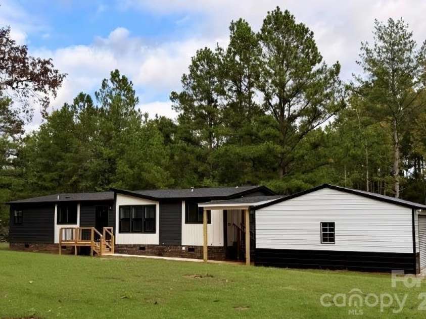 1700 Logan Terry Road, Lancaster, SC 29720.  MLS# CAR4366463, YatesRealty ID 17759. Axis plan with oversized two car garage.
