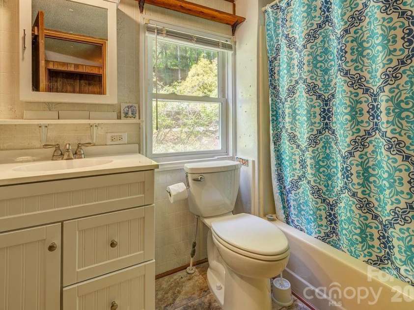 64 Haw Creek Circle, Asheville, NC 28805.  MLS# CAR4365839, YatesRealty ID 17770. Upgraded bath. Access from primary and hall.