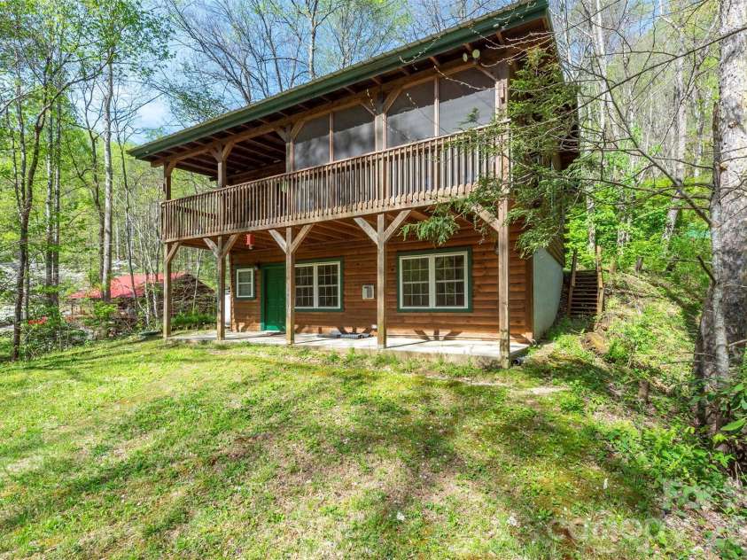 196 Friar Tuck Lane, Maggie Valley, NC 28751.  MLS# CAR4361658, YatesRealty ID 17771. 2 BR, 2BA Cabin with level back yard