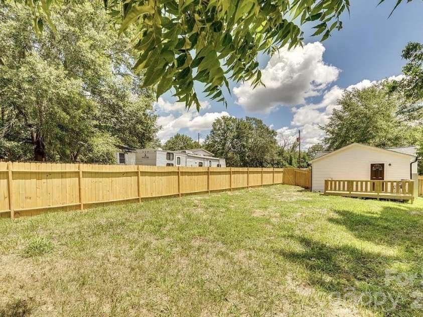 140 Plyler Road, Lancaster, SC 29720.  MLS# CAR4377116, YatesRealty ID 17784. Fence before staining