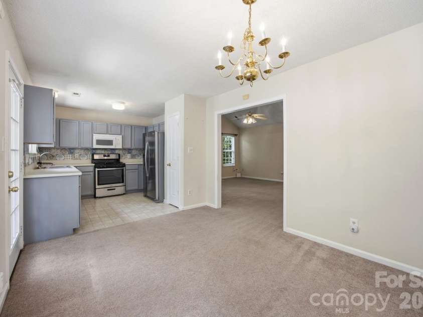 8616 Mineral Ridge Way, Charlotte, NC 28269.  MLS# CAR4377358, YatesRealty ID 17788. Dining room and Kitchen
