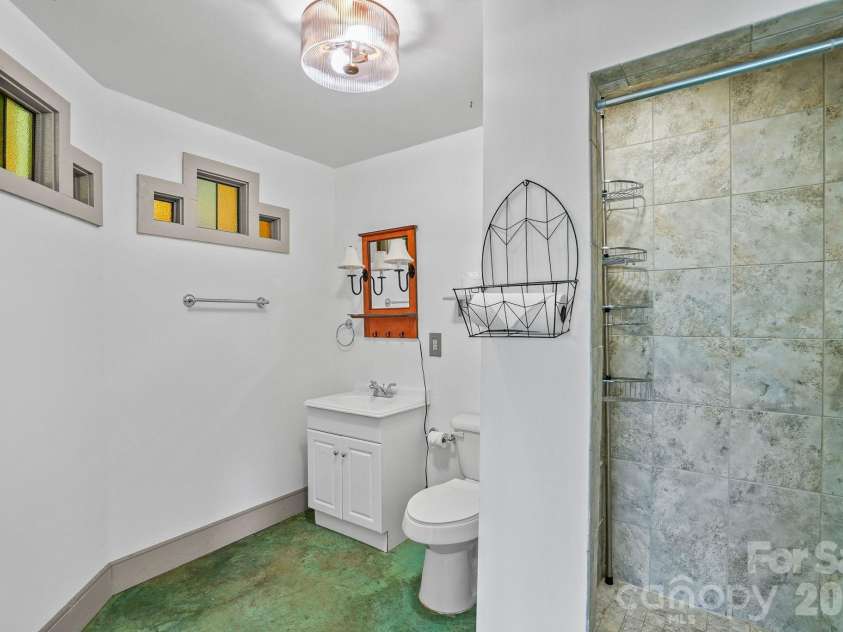 310 Burr Ridge, Marshall, NC 28753.  MLS# CAR4365962, YatesRealty ID 17797. Full bathroom with shower that features custom tile work