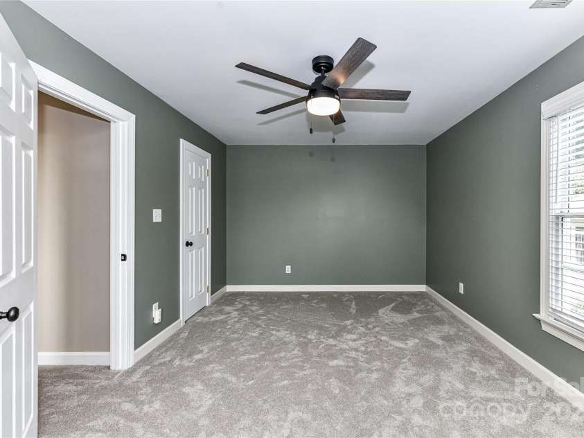 4637 Shannamara Drive, Matthews, NC 28104.  MLS# CAR4264380, YatesRealty ID 17797. Bonus Room with attic storage space & ceiling fan/light!