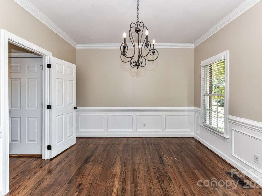 4637 Shannamara Drive, Matthews, NC 28104.  MLS# CAR4264380, YatesRealty ID 17797. Formal Dining Room features crown molding & wainscoting!