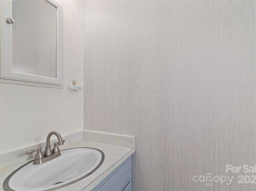 641 Camelot Drive, Waynesville, NC 28786.  MLS# CAR4244249, YatesRealty ID 17801. En-suite half bath