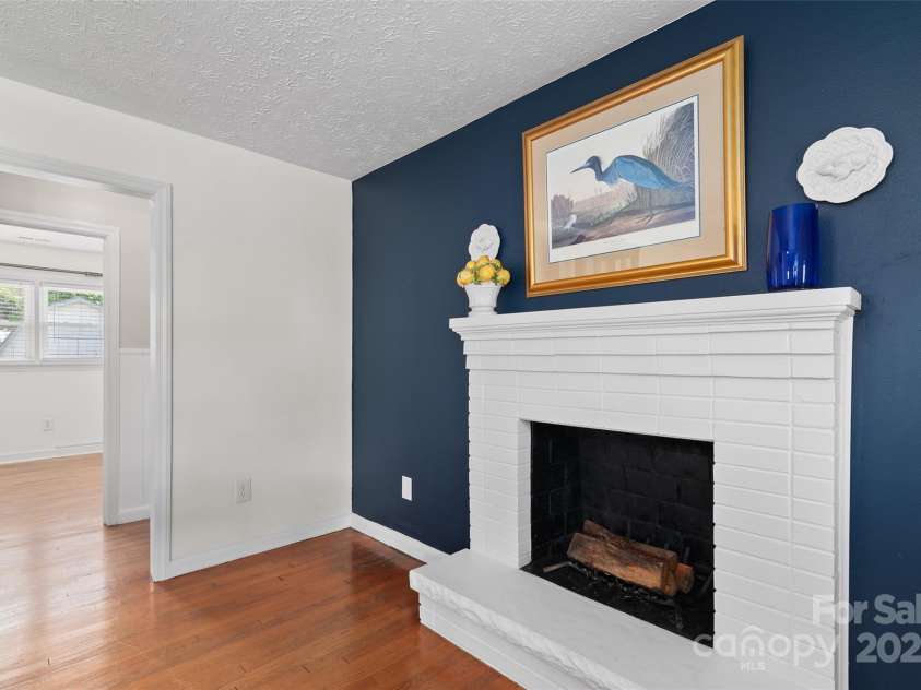 641 Camelot Drive, Waynesville, NC 28786.  MLS# CAR4244249, YatesRealty ID 17801. Fireplace in the living room
