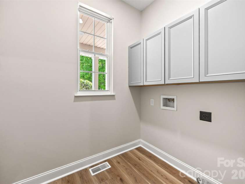 7520 Carmel Road, Charlotte, NC 28226.  MLS# CAR4372217, YatesRealty ID 17802. Dedicated laundry room on main level near garage entry