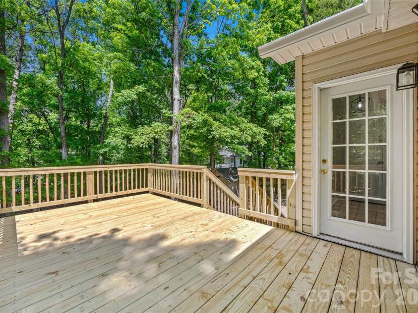 7520 Carmel Road, Charlotte, NC 28226.  MLS# CAR4372217, YatesRealty ID 17802. Oversized NEW deck for entertaining!