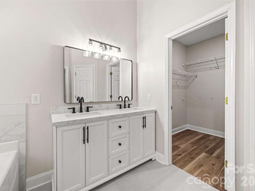 7520 Carmel Road, Charlotte, NC 28226.  MLS# CAR4372217, YatesRealty ID 17802. Quartz countertop and double vanities