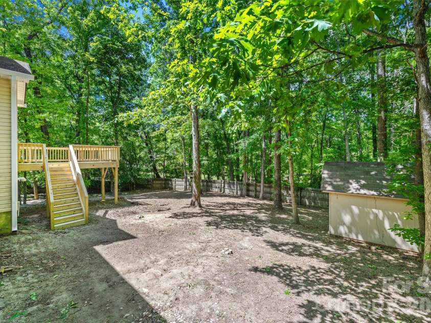 7520 Carmel Road, Charlotte, NC 28226.  MLS# CAR4372217, YatesRealty ID 17802. Storage shed on property 