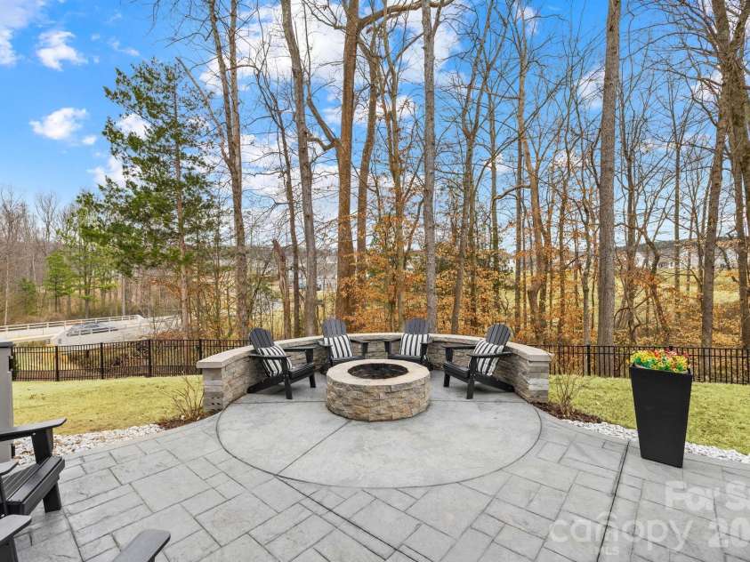 336 Streamwood Road, Troutman, NC 28166.  MLS# CAR4349283, YatesRealty ID 17803. Backyard firepit