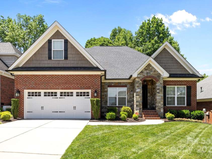 4004 Saint Andrews Court, Cramerton, NC 28032.  MLS# CAR4265985, YatesRealty ID 17805. Carriage House style garage door with windows