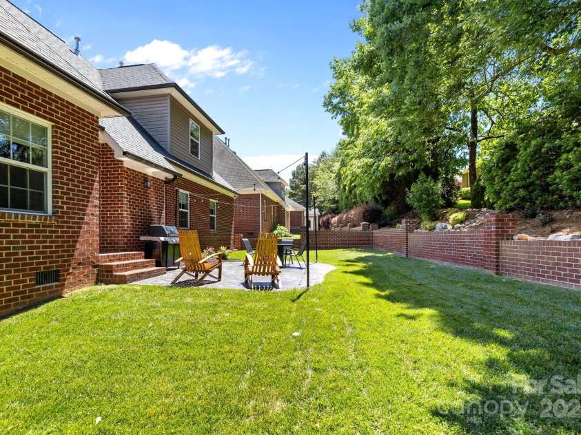 4004 Saint Andrews Court, Cramerton, NC 28032.  MLS# CAR4265985, YatesRealty ID 17805. French drain installed behind brick retaining wall