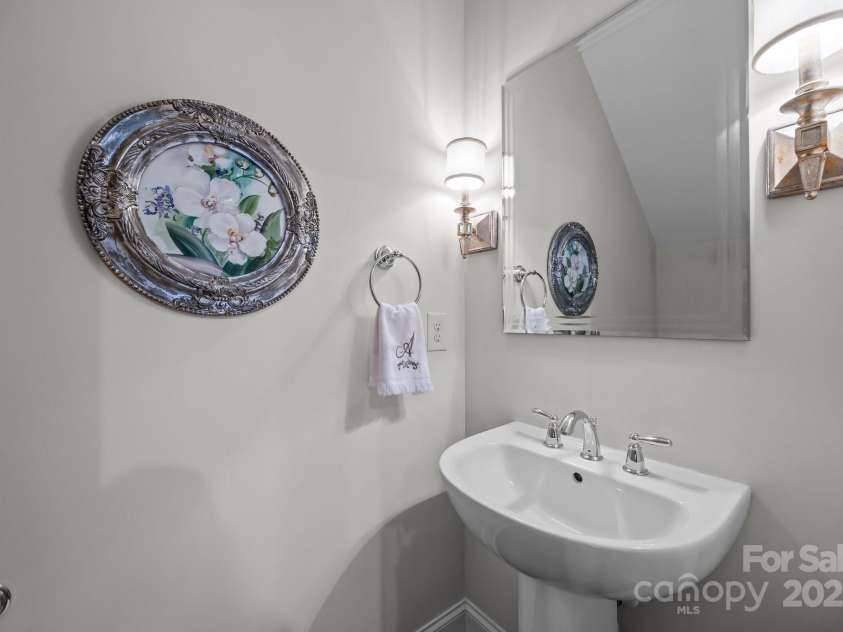 4004 Saint Andrews Court, Cramerton, NC 28032.  MLS# CAR4265985, YatesRealty ID 17805. Half bath with sconce style lighting