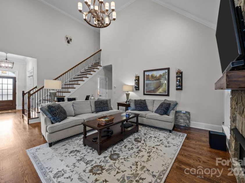 4004 Saint Andrews Court, Cramerton, NC 28032.  MLS# CAR4265985, YatesRealty ID 17805. Soaring ceilings, natural light, above fireplace pull-down TV mount for perfect eye-level viewing