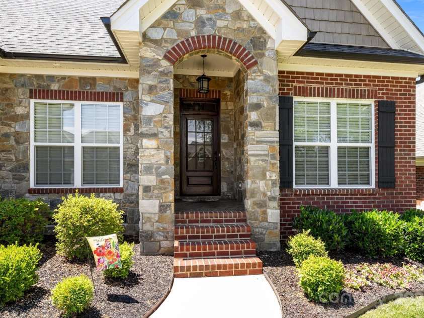 4004 Saint Andrews Court, Cramerton, NC 28032.  MLS# CAR4265985, YatesRealty ID 17805. Stained 3/4 lite, 9 lite front door