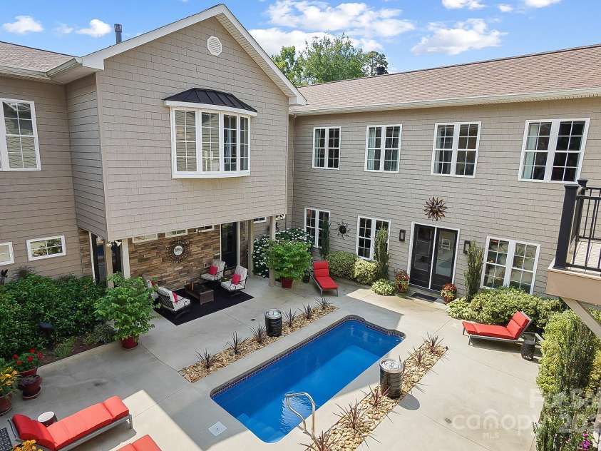 2354 Valelake Road, York, SC 29745.  MLS# CAR4266023, YatesRealty ID 17806. The courtyard pool and entertainment area offer extreme privacy, and you can monitor guests and family from multiple living areas throughout the home for added security when kids or pets are playing.