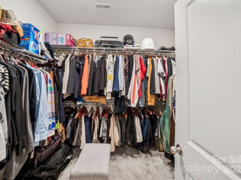9525 Festival Way, Charlotte, NC 28215.  MLS# CAR4263190, YatesRealty ID 17807. Spacious Primary Closet.