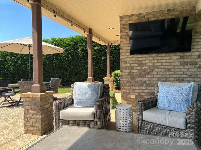 3000 J R Court, Stanley, NC 28164.  MLS# CAR4254396, YatesRealty ID 17811. Covered sitting area by the pool.