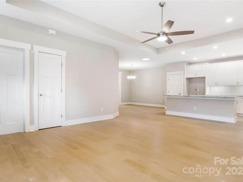 48 Creekside View Drive, Asheville, NC 28804.  MLS# CAR4046496, YatesRealty ID 17815. Alternate view of living room with open concept to kitchen and dining area.