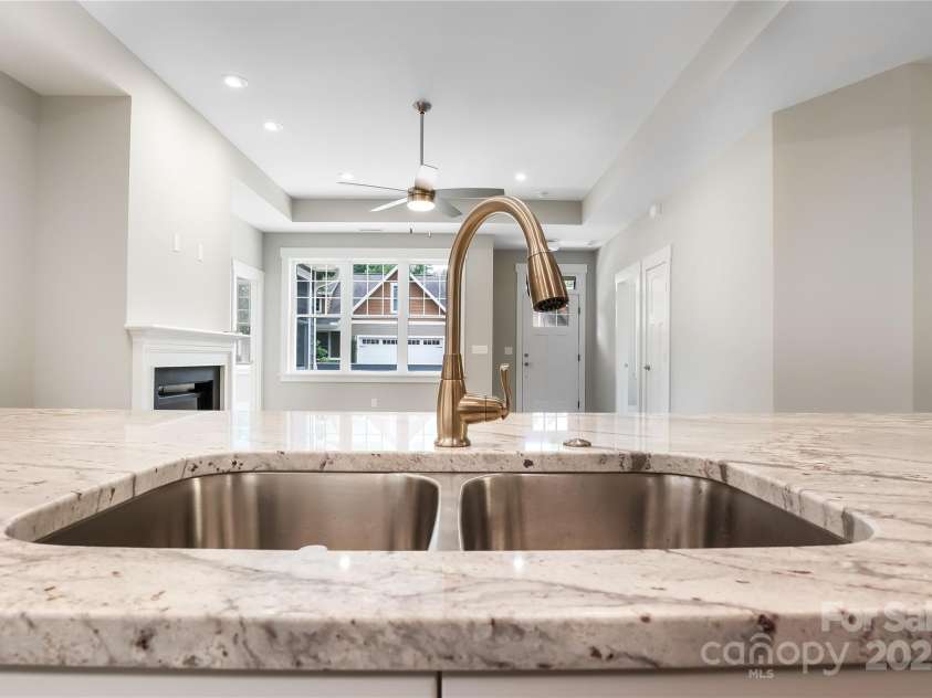 48 Creekside View Drive, Asheville, NC 28804.  MLS# CAR4046496, YatesRealty ID 17815. Open concept kitchen looking into the living room