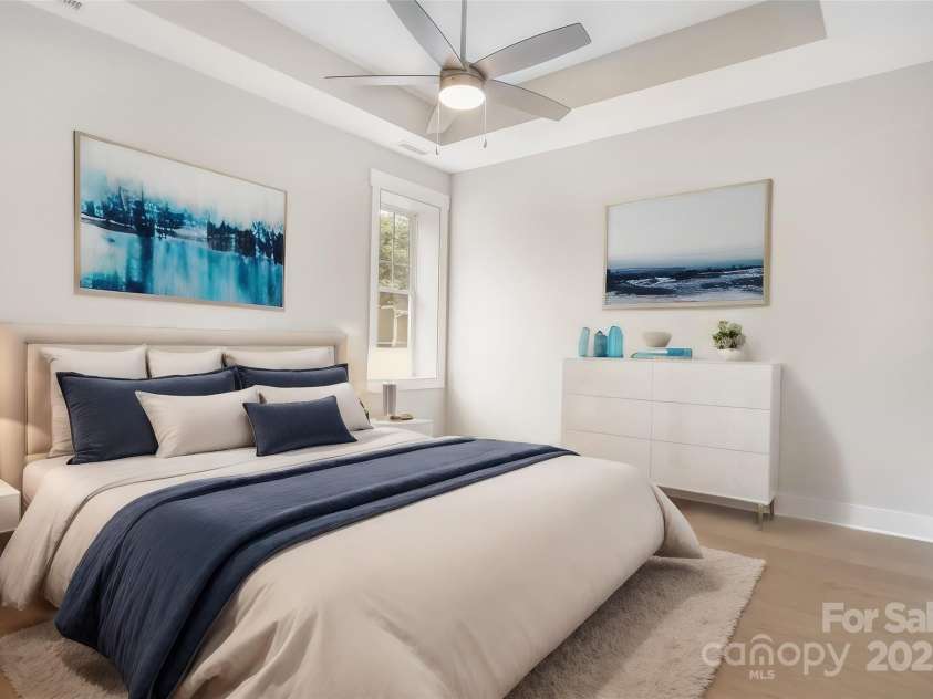 48 Creekside View Drive, Asheville, NC 28804.  MLS# CAR4046496, YatesRealty ID 17815. Virtually staged primary bedroom with trey ceiling and ceiling fan.