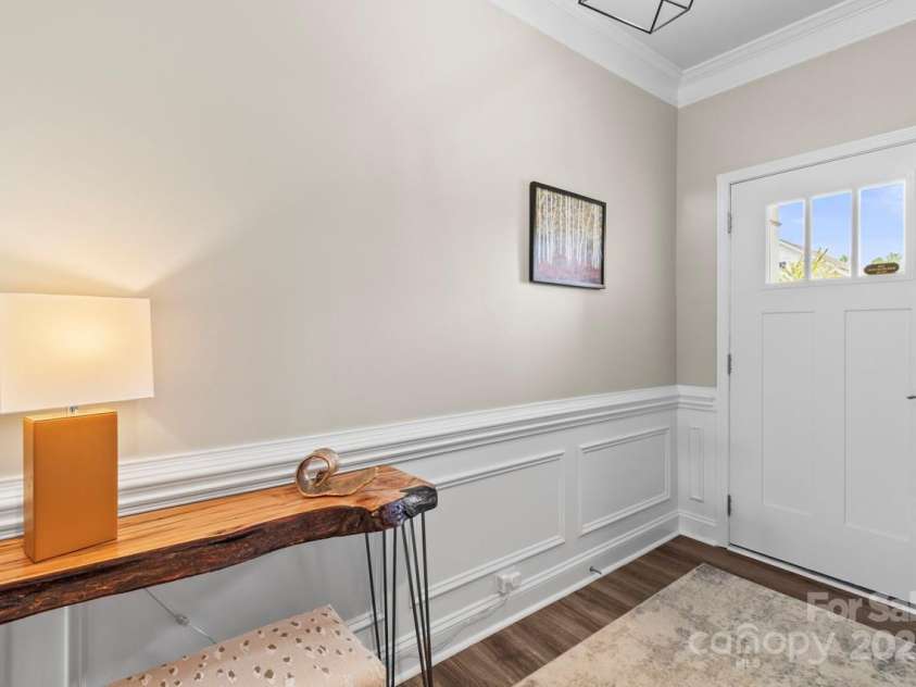 329 Secretariat Drive, Iron Station, NC 28080.  MLS# CAR4253728, YatesRealty ID 17822. Entry view spotlighting the crown, chair rail and picture frame moldings