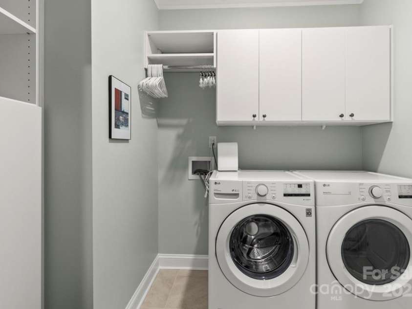 329 Secretariat Drive, Iron Station, NC 28080.  MLS# CAR4253728, YatesRealty ID 17822. Laundry room with cabinets and room to hang your delicates