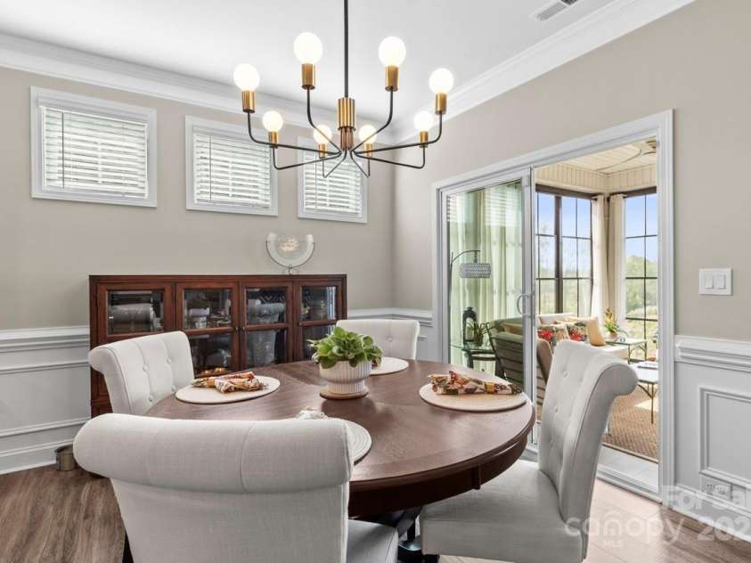 329 Secretariat Drive, Iron Station, NC 28080.  MLS# CAR4253728, YatesRealty ID 17822. Sunlit dining area enhanced by clerestory windows and elegant trim details