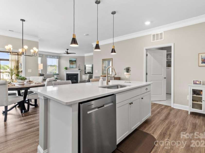 329 Secretariat Drive, Iron Station, NC 28080.  MLS# CAR4253728, YatesRealty ID 17822. The kitchen opens to the dining area and family room making entertainment effortless