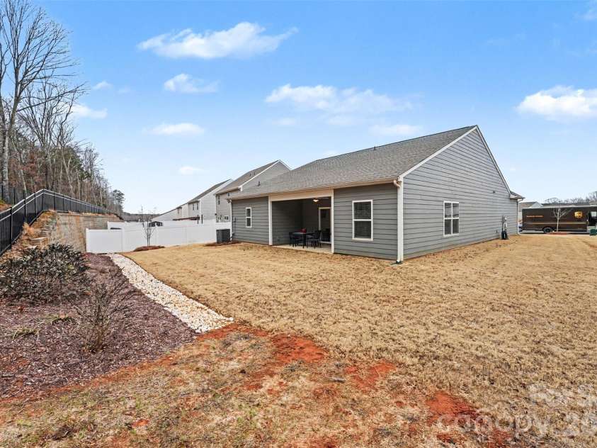 115 Tradesmen Trail, Troutman, NC 28166.  MLS# CAR4350971, YatesRealty ID 17825. Lovely landscaping will bloom in the spring