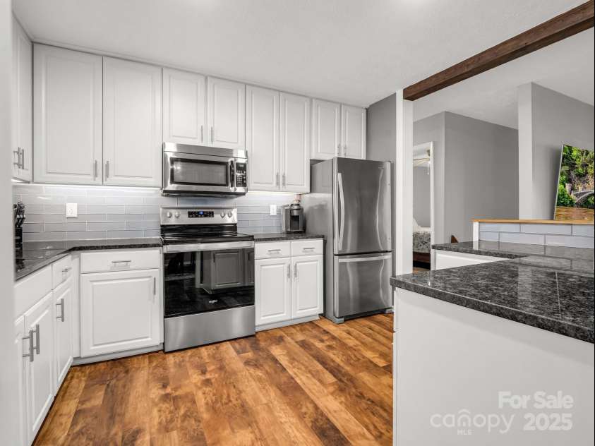 195 White Pine Drive, Lake Lure, NC 28746.  MLS# CAR4266532, YatesRealty ID 17828. Island kitchen with stainless appliances.