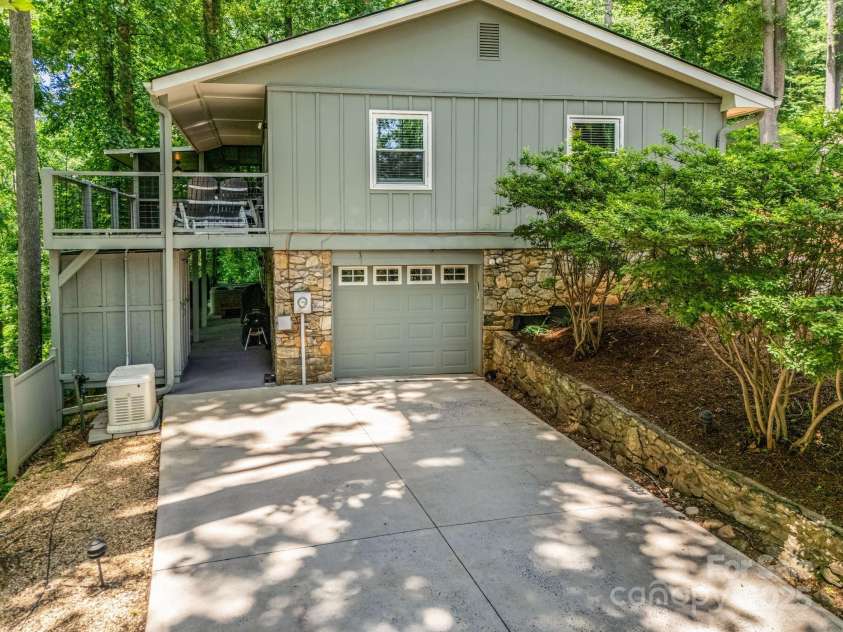 195 White Pine Drive, Lake Lure, NC 28746.  MLS# CAR4266532, YatesRealty ID 17828. Plenty of parking is available in the 1-car oversized garage as well as the lower level driveway and upper-level parking area.